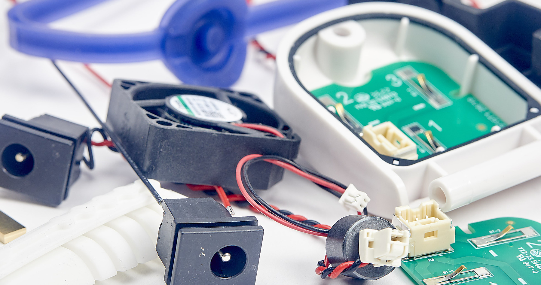 Internal view of a Kii.am-built device showing LED array, PCBA and twin cooling fans integrated together